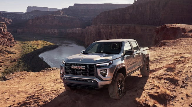 The GMC Canyon Elevation Parked Off-Road Near A Cliff and Water