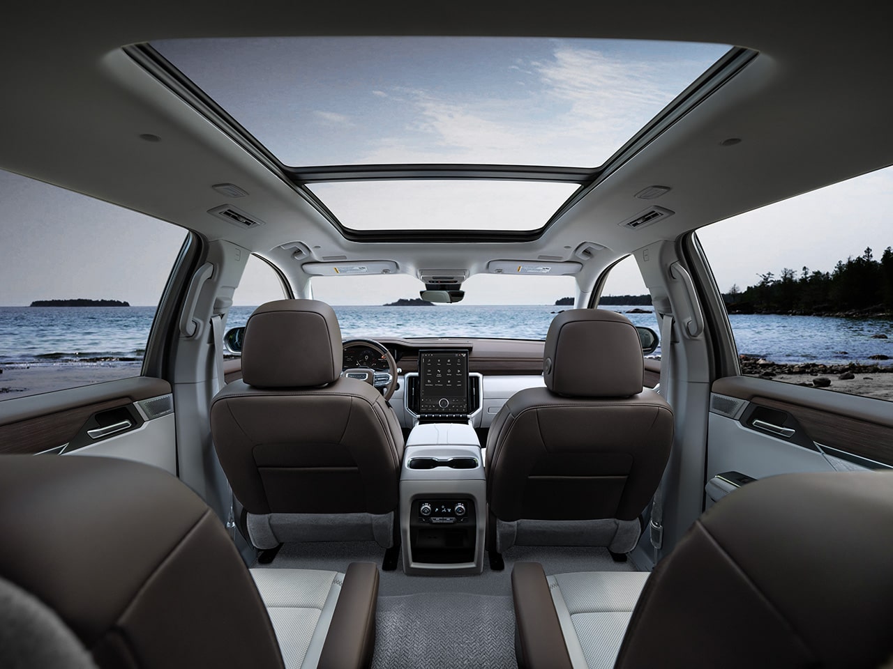 Interior View of the Interior Front Row Seats in the 2026 GMC Acadia Denali from the Second Row Seats