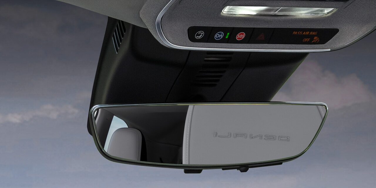 Close-up of the Driver Pressing the OnStar Button in Their GMC