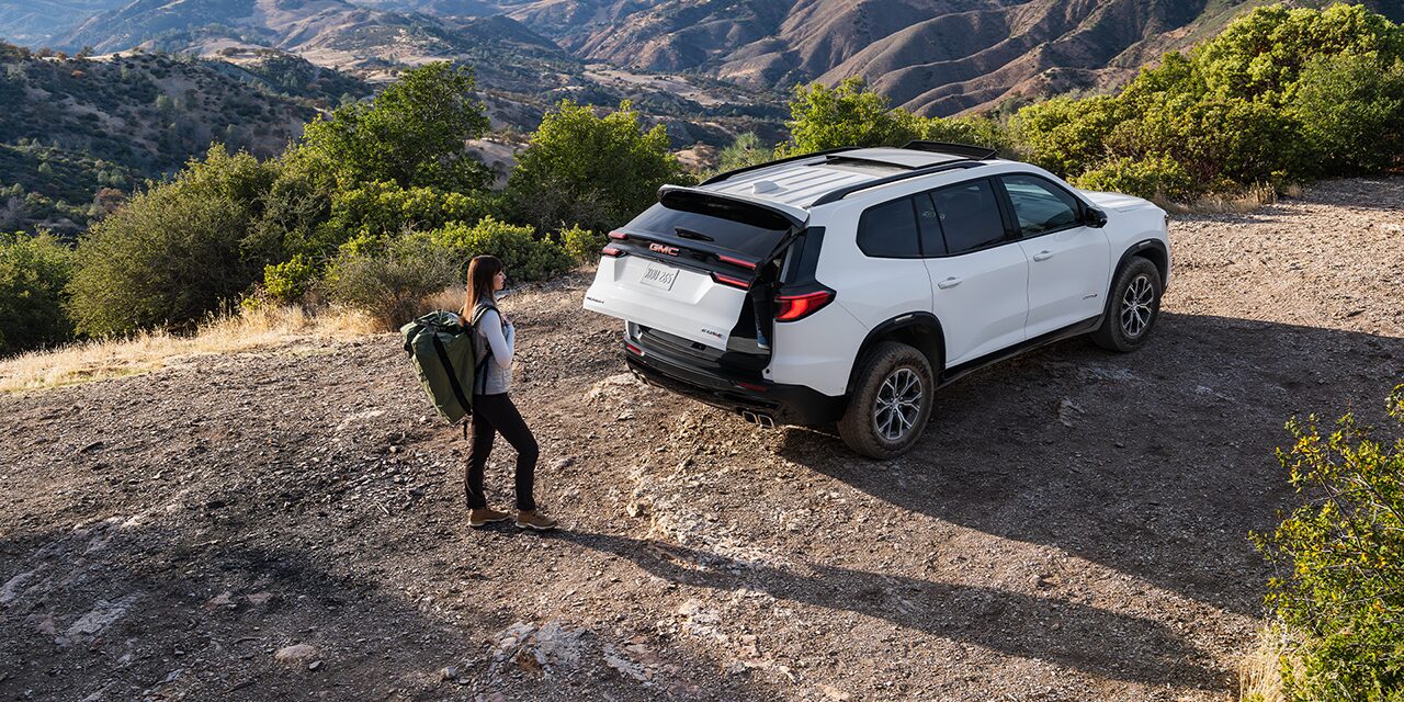 Birds-eye View of a Man Using the Autosense Power Liftgate on the GMC Acadia Mid-Size SUV