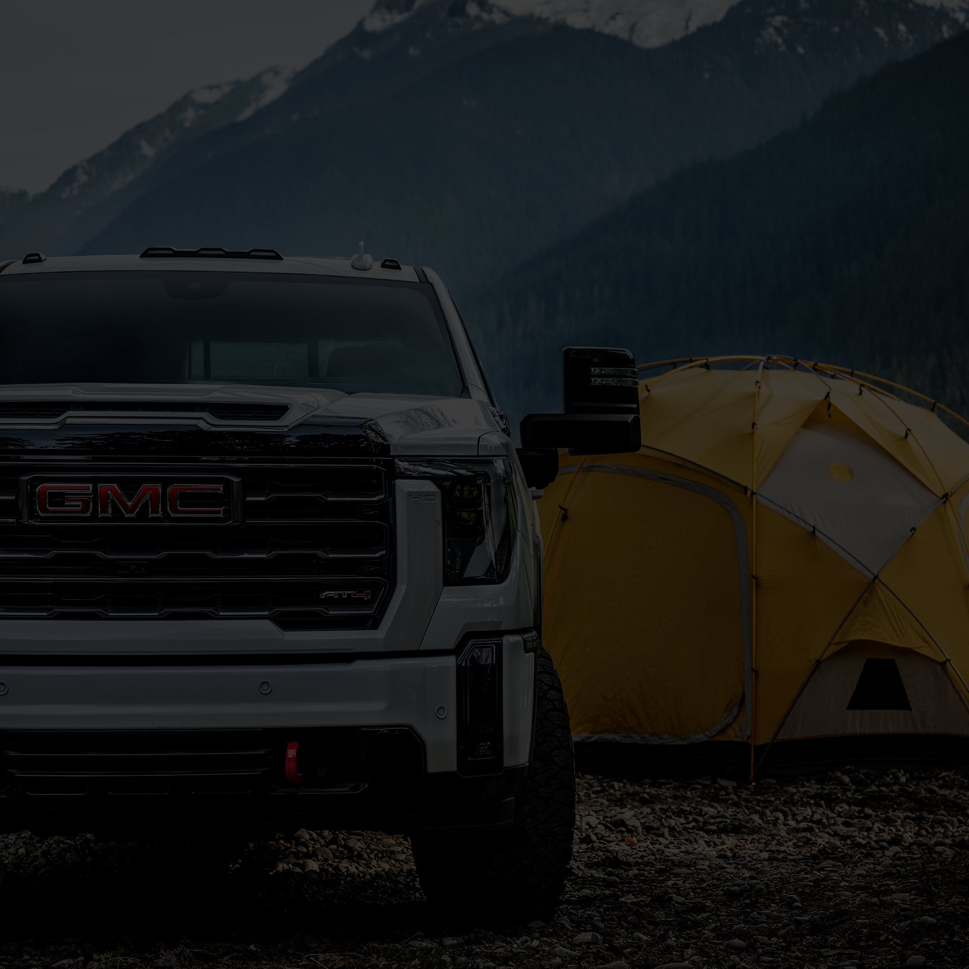 A 2026 GMC Sierra HD Parked Next to a Tent with "View Exterior" Text Overlay
