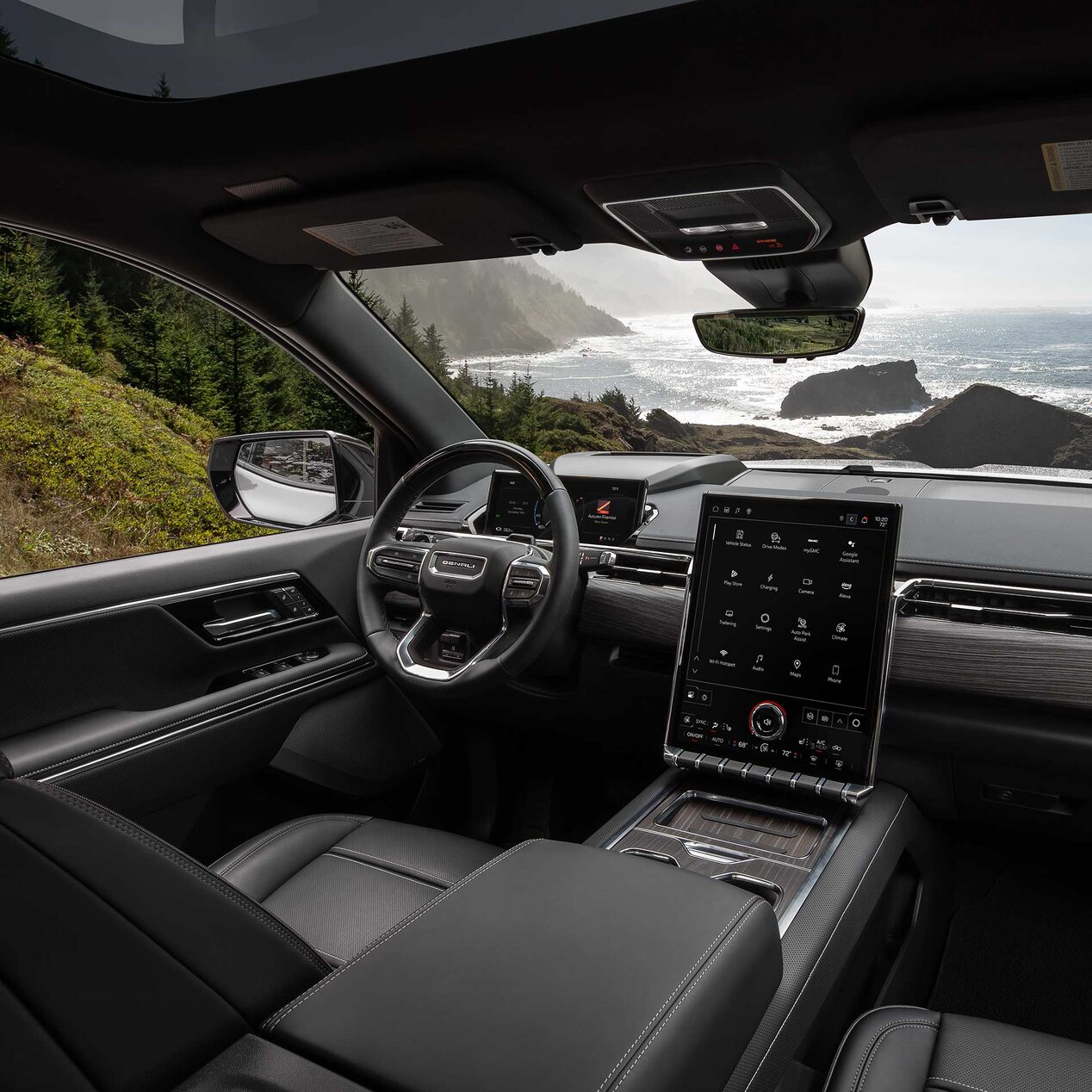 Interior View of the Steering Wheel and Infotainment Screen in the Sierra EV Pickup Truck